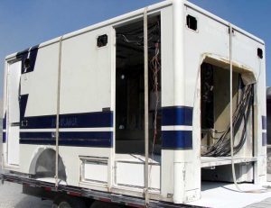 Media blasting and powder coating FAQ.  Box of an ambulance before paint stripping with baking soda