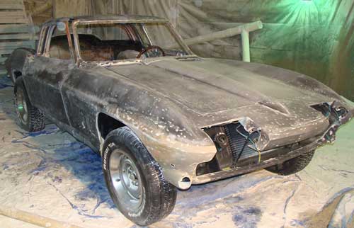 Paint and metal stripping.  Corvette after soda blasting removed paint and rust.  