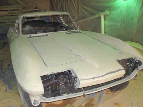 Paint and metal stripping.  Corvette before paint removal. 