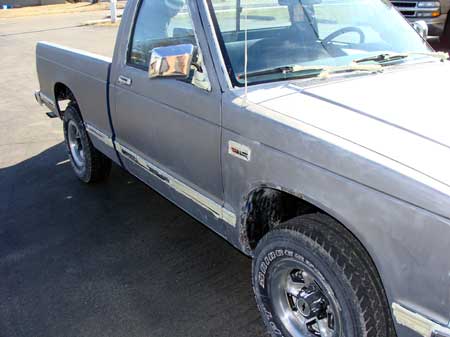 Pickup truck after paint removed by soda cleaning