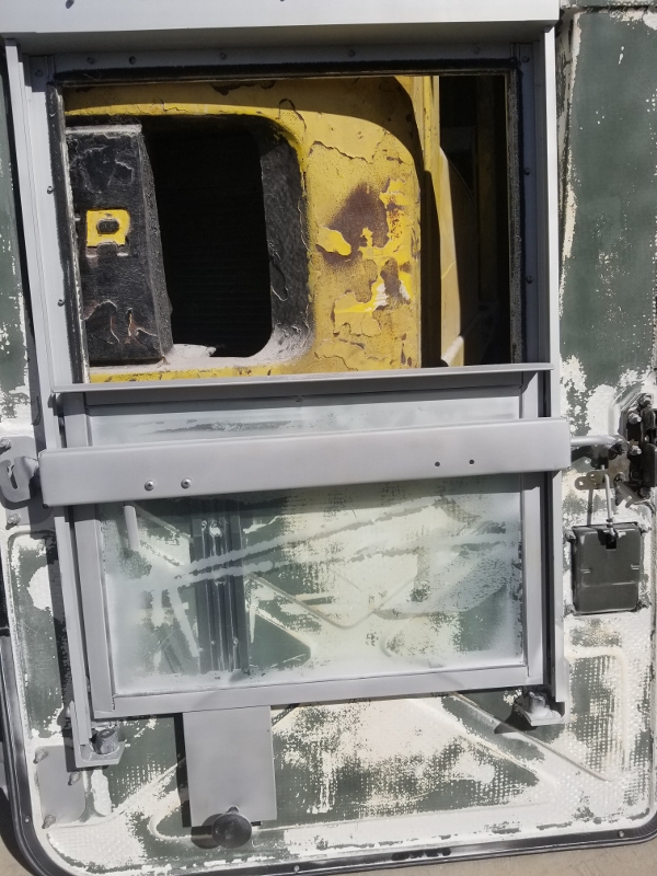 Kevlar door from a Humvee before paint removal.