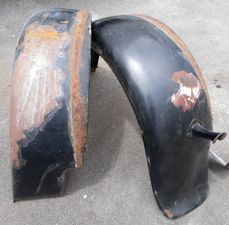 Paint and metal stripping. Model A fenders ready for soda blasting.