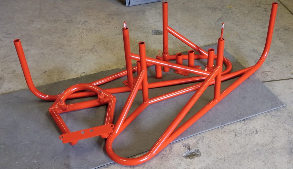 Paint and metal stripping. Race car frame after powder coating.