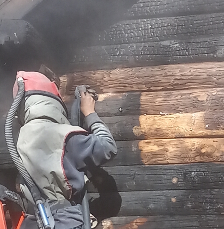 Video. Log home cleaning & restoration. Smoke and char are being removed from this log home after a fire.