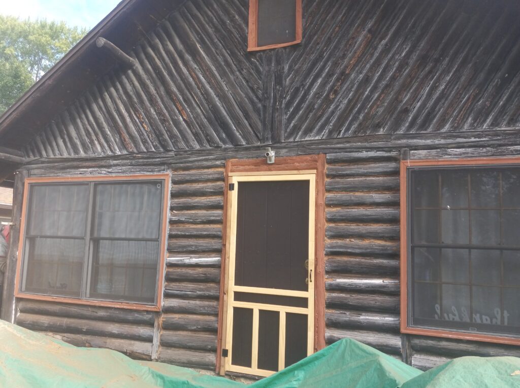 Log cabin before media blasting