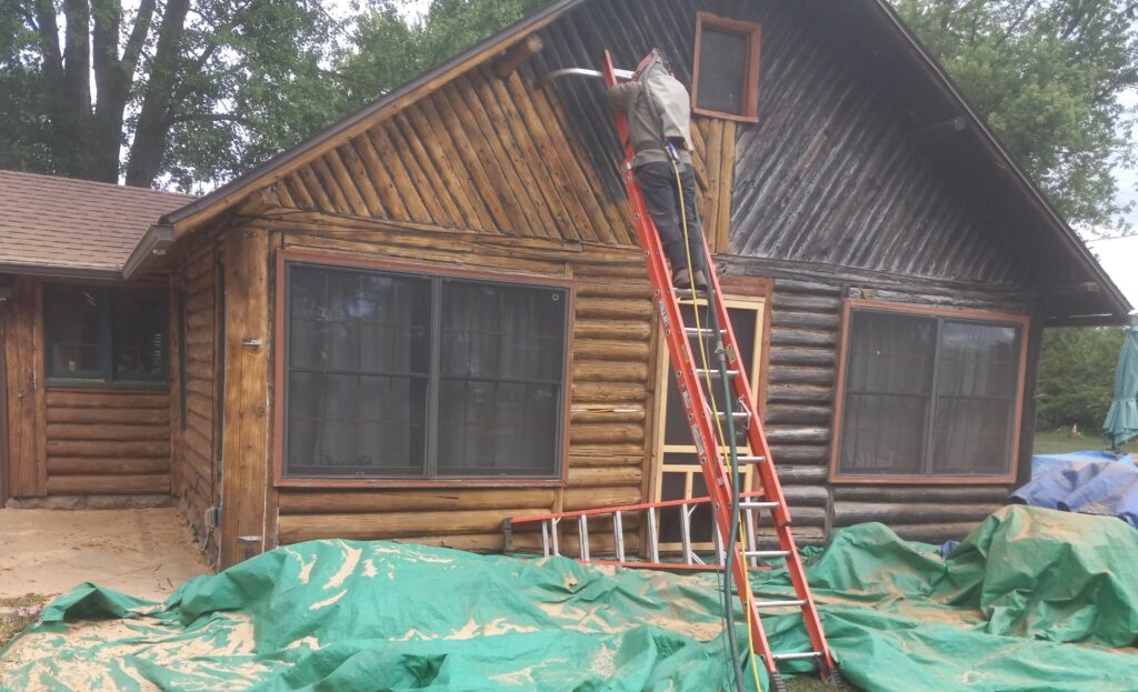 Log cabin partially cleaned